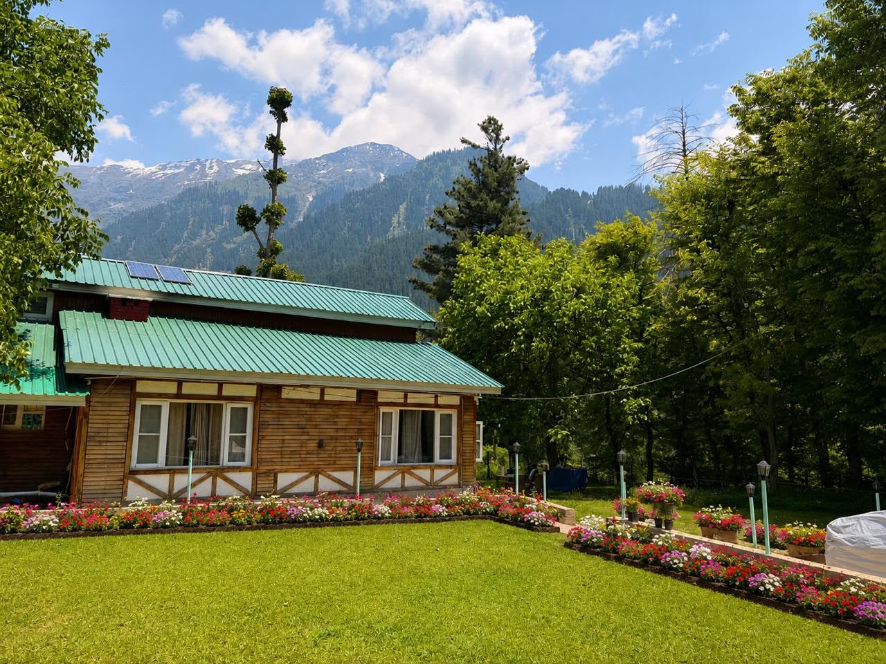 Garden view with snow-capped mountains behind KashÔtel